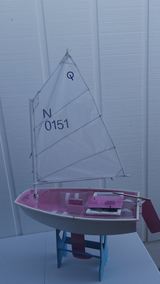 Mini Opti hull# 0151 White/Pink hull. Includes cradle, Radio Transmitter, and Servos. All setup and adjusted for easy sailing. Just find a pond, lake, or any place to set sail and enjoy. (Copy)