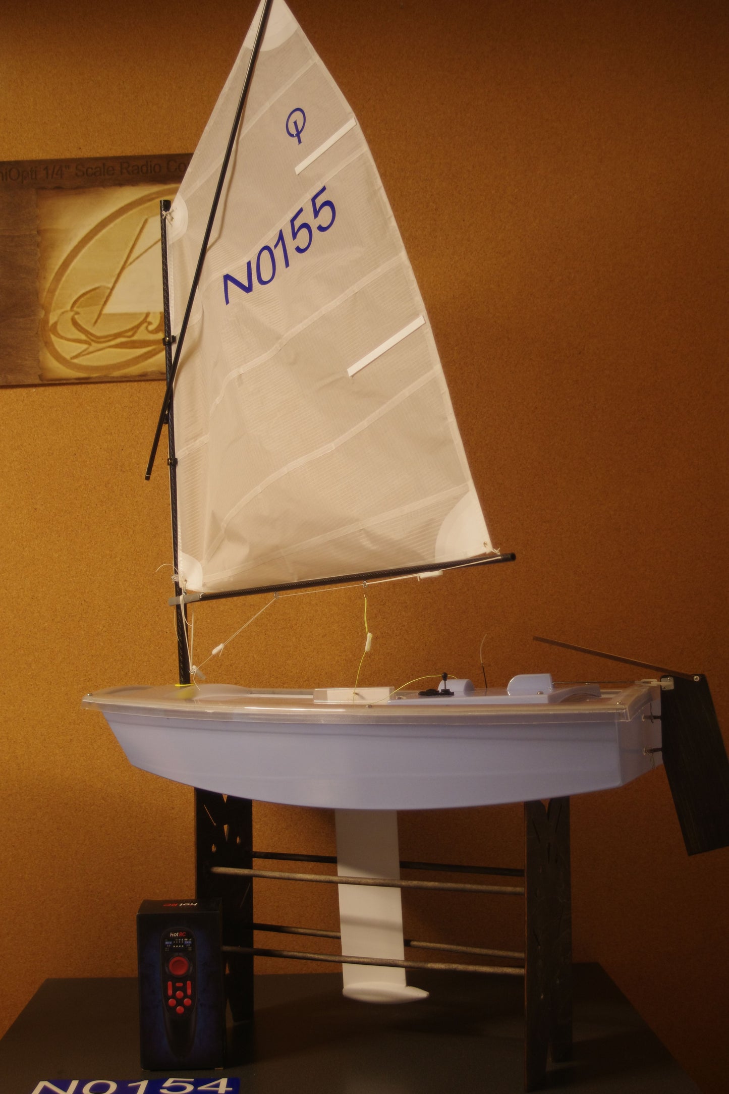 Miniopti Hull#0155 Light Blue Hull, setup & tuned complete with White Regatta sail and stand