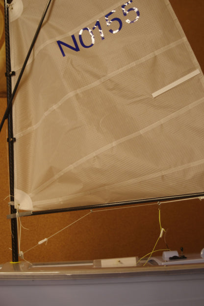 Miniopti Hull#0155 Light Blue Hull, setup & tuned complete with White Regatta sail and stand