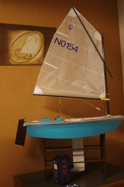 Miniopti Hull#0154 setup tuned complete with White Regatta sail and stand