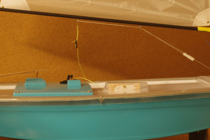 Miniopti Hull#0154 setup tuned complete with White Regatta sail and stand