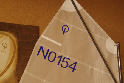 Miniopti Hull#0154 setup tuned complete with White Regatta sail and stand